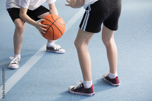 Pupils playing basketball