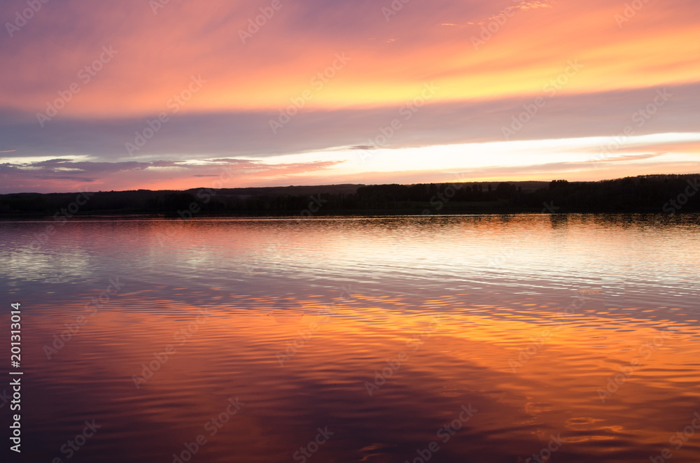 Beautiful Saskatchewan sunset and reflection over a lake
