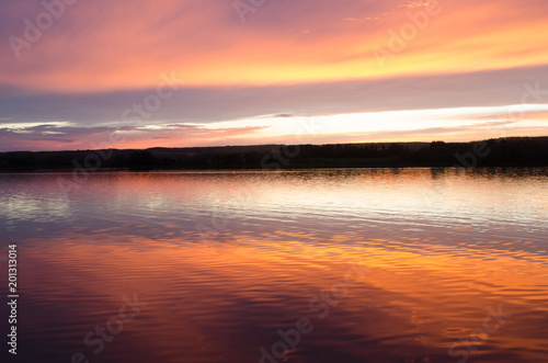 Beautiful Saskatchewan sunset and reflection over a lake