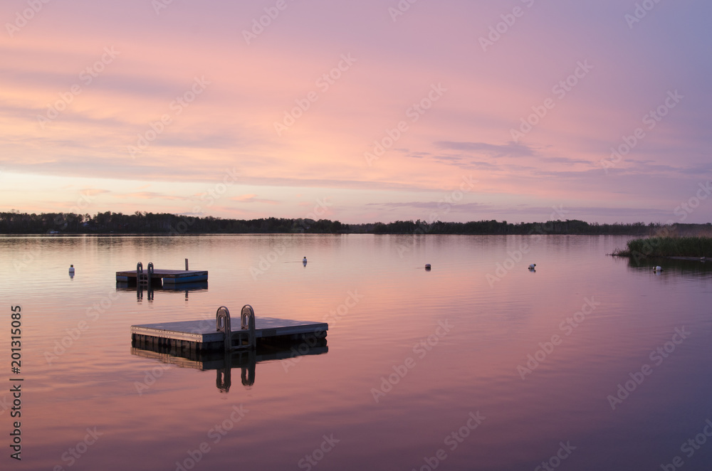 Floating docks on Struthers Lake with a beautiful sunset