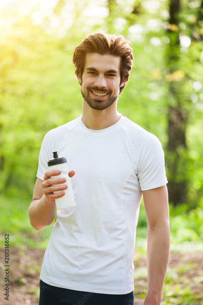 Young man is ready for exercising in park. Young man is ready for exercising in park.