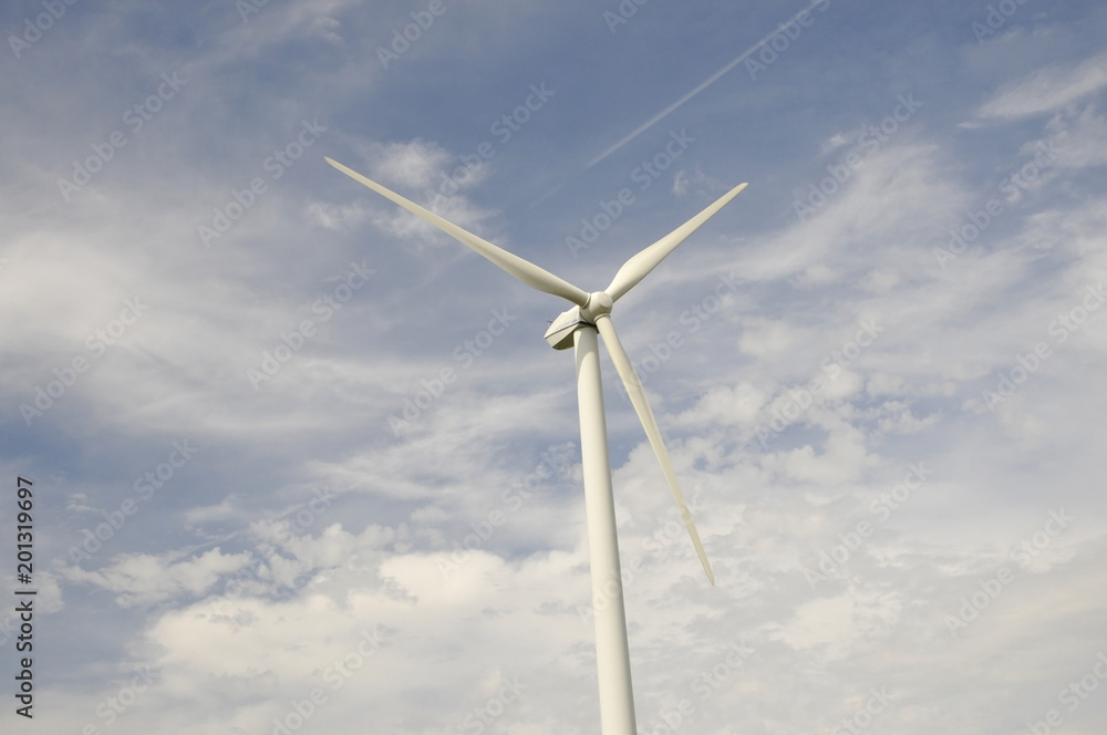 Head of a Wind Turbine with a Blue and Cloudy Sky Head of a Wind Turbine with a Blue and Cloudy Sky