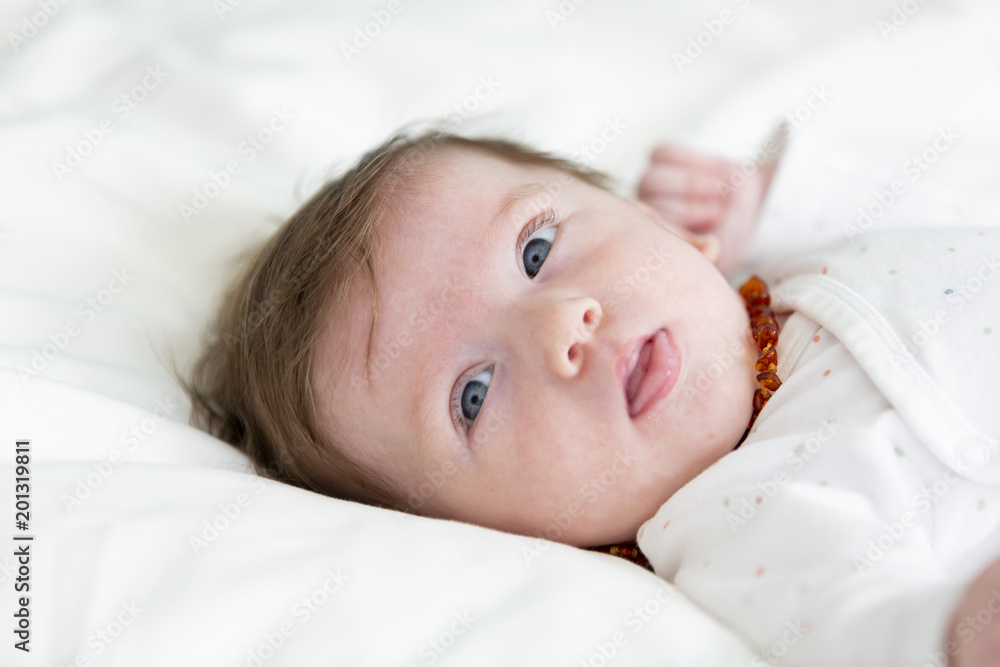 3 month old beautiful, cute baby with amber necklace 3 month old beautiful, cute baby with amber necklace