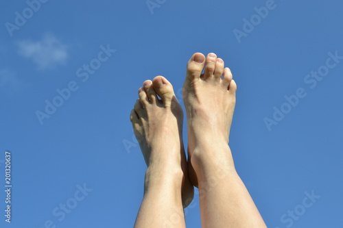 Feet on the sky backgraund.
