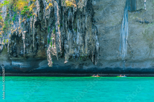 Tourist Kayak boat trip at Krabi Andaman sea cliff Thailand summer travel.