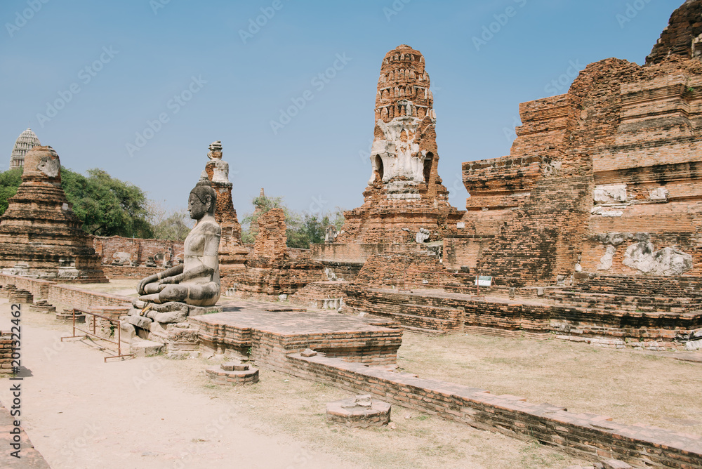Naklejka premium Wat Mahathat temple at Ayutthaya Historical Park, Thailand. A UNESCO world heritage site