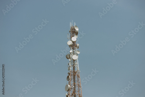 Telecommunication tower with antennas with blue sky