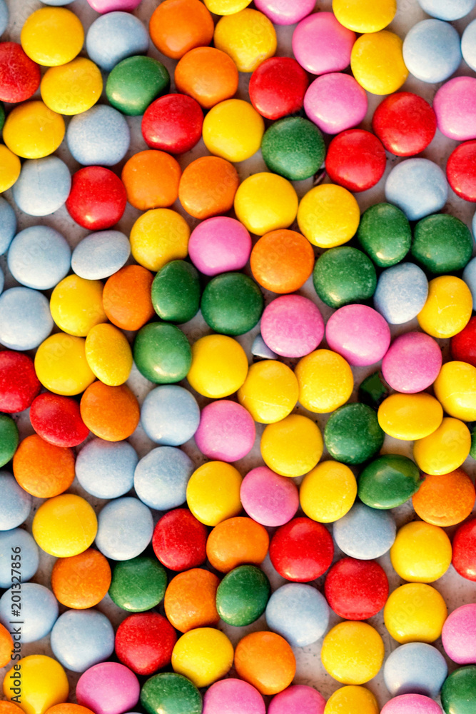 Obraz premium Colorful candy pattern background. Different Small colored candies texture. Top view..