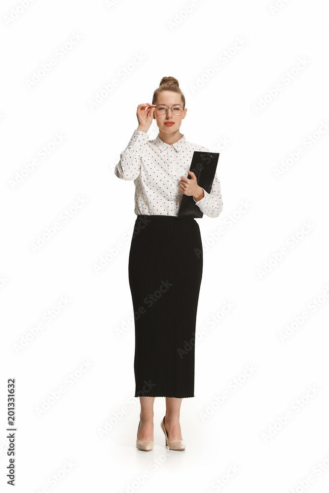 Full length portrait of a smiling female teacher holding a folder isolated against white background Full length portrait of a smiling female teacher holding a folder isolated against white background