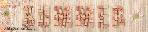 Word SUMMER made of wine corks on sea twine background and Colorful seashells. Banner