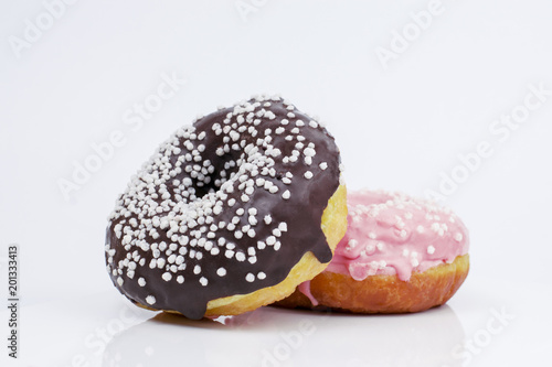 .Sweet fried donuts on white background closeup