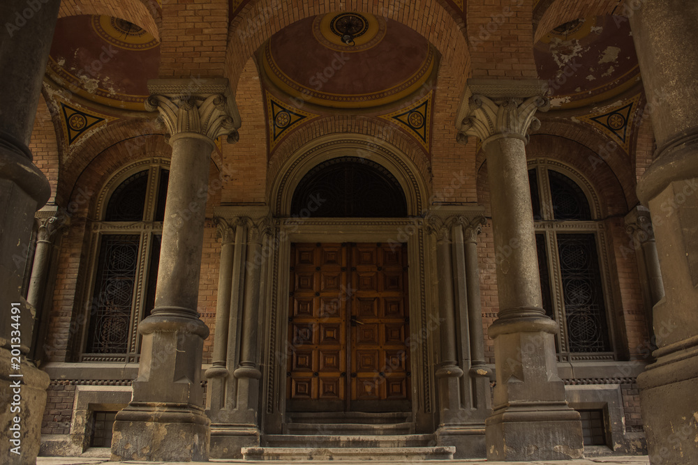 old renaissance palace yard with column and door