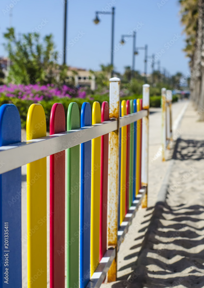 Colorful fence on the beach