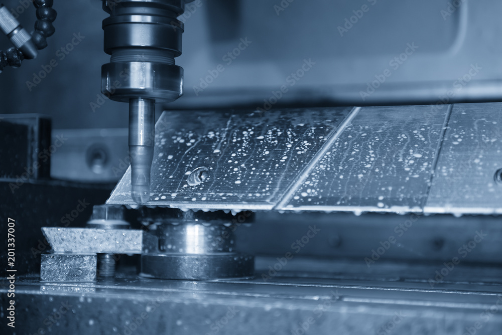 The CNC milling machine cutting the aluminum automotive part with the solid ball endmill in the light blue scene. The CNC milling machine cutting the aluminum automotive part with the solid ball endmill in the light blue scene.