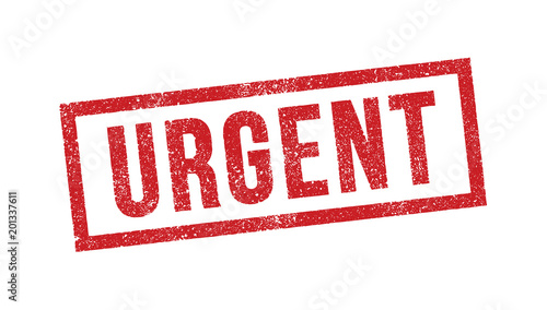 Tampon avec le mot Urgent en encre rouge photo
