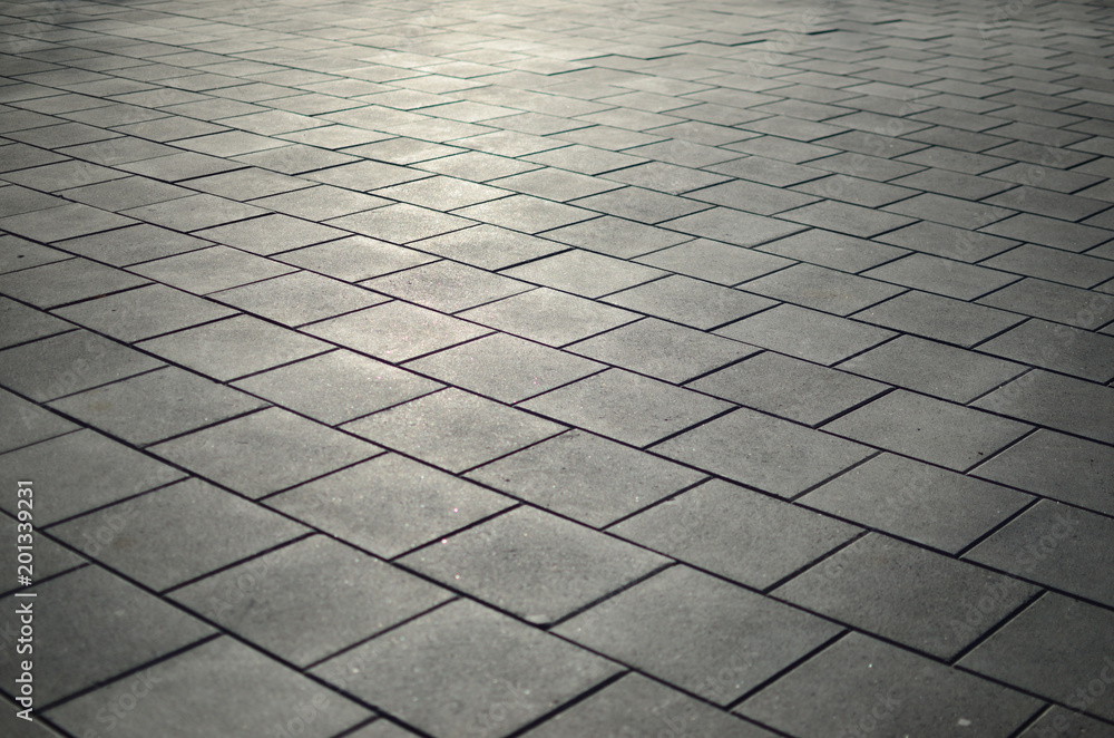 Fototapeta premium Gray paving slabs in the city