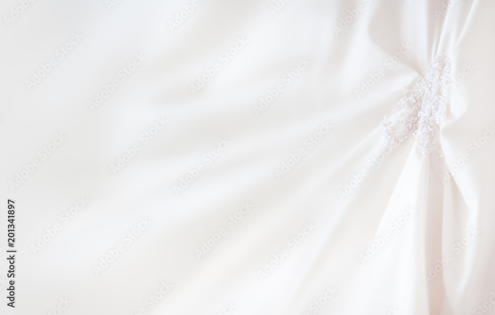 Bride's dress with embroidered elements and beads. Bridal traditional symbolic accessory for wedding ceremony. Place for text. Bride's dress with embroidered elements and beads. Bridal traditional symbolic accessory for wedding ceremony. Place for text.