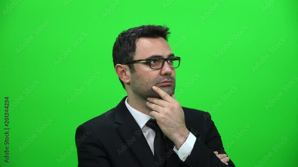 Serious Man Looking Sideways on Green Screen Background Serious Man Looking Sideways on Green Screen Background
