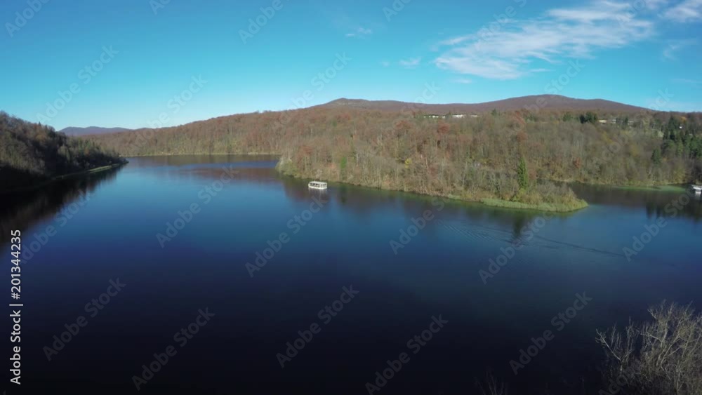 Aerial of a boat on a lake in Plitvice Park Aerial of a boat on a lake in Plitvice Park