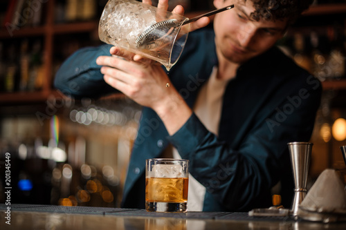 Wallpaper Mural barman finishes preparing an alcoholic cocktail Old Fashioned Torontodigital.ca
