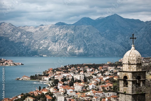 Church of our Lady of Remedy overlooks the red tiled City, bay of Kotor and Montenegro Mountains