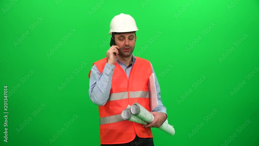 Engineer Talking on Phone and Hold in Hand Blueprint Papers Engineer Talking on Phone and Hold in Hand Blueprint Papers