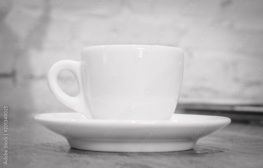 Coffee cup on the table. (Black and white tone)