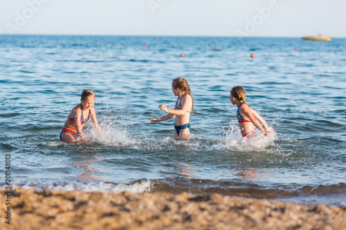 Happy kids on the beach © len44ik