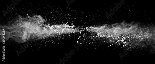 Foto Abstract white powder explosion isolated on black background.
