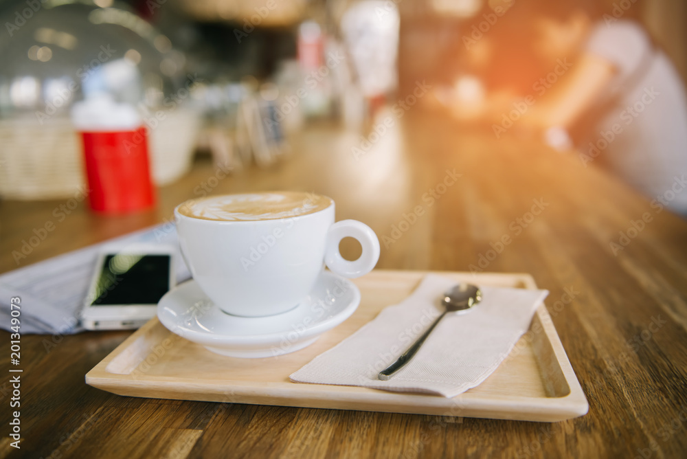 Fototapeta premium cup of coffee tablet and smart phone on wooden table