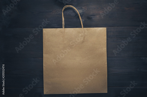 disposable bag of kraft paper on a wooden table