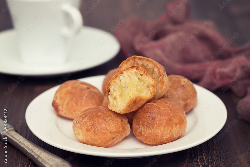 Brazilian snack cheese bread on white plate Brazilian snack cheese bread on white plate