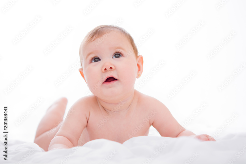 Adorable little baby girl smiling on white background
Adorable little baby girl smiling on white background