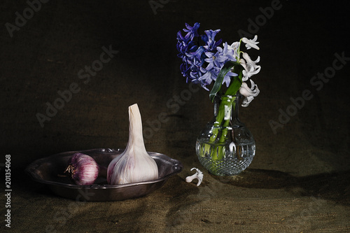 still life with garlic and a bouquet of flowers in a vase2 photo