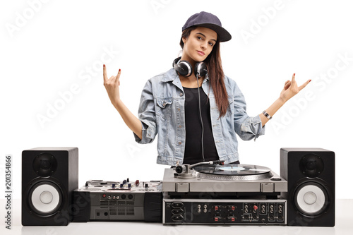 Fotografie Female DJ making rock hand gestures