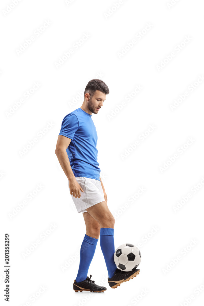 Fototapeta premium Soccer player juggling a football