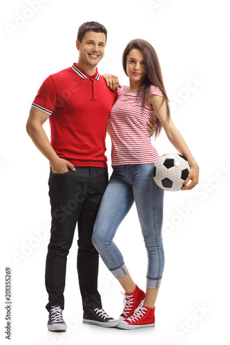 Young couple with a football
