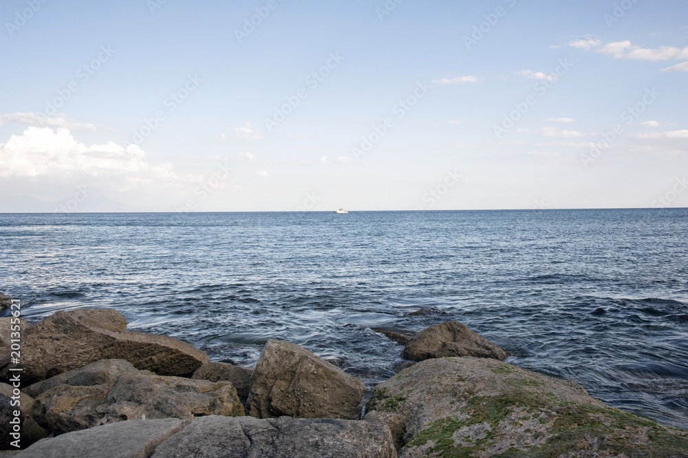 A boat at the horizon