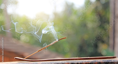 Fotografie Incense stick and smoke from incense burning