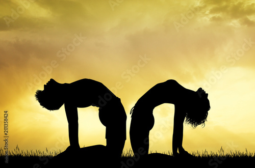 couple in camel yoga pose © adrenalinapura