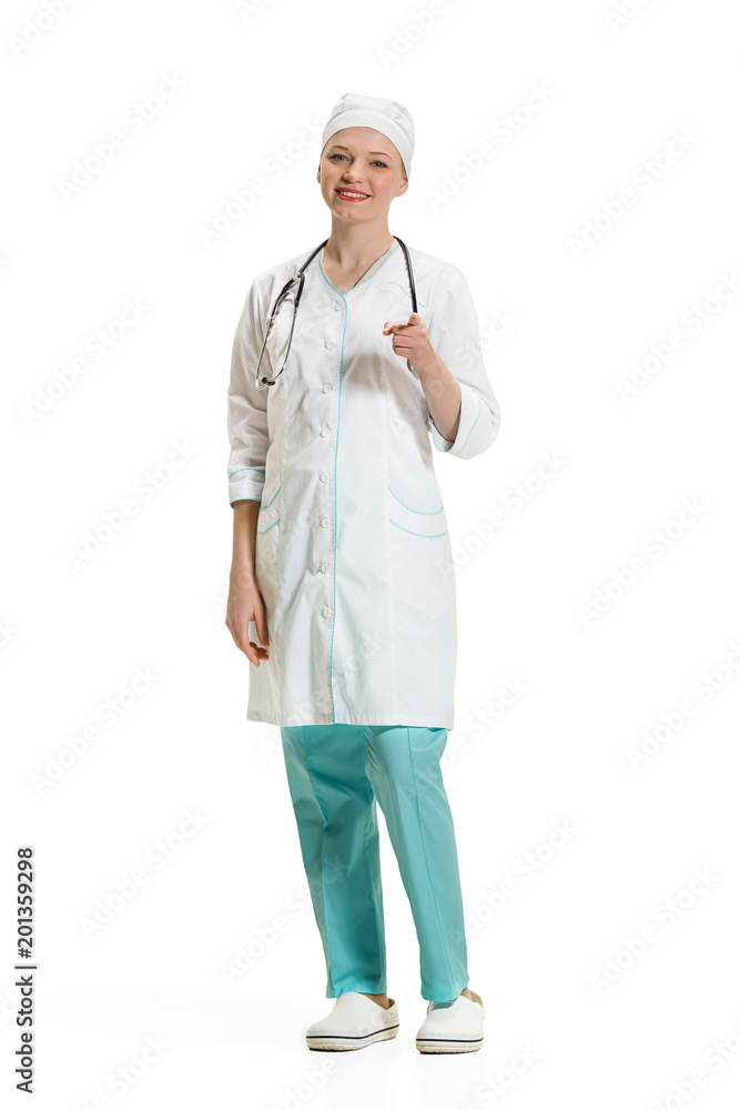 Beautiful young woman in white coat posing at studio. Full length studio shot isolated on white. Beautiful young woman in white coat posing at studio. Full length studio shot isolated on white.
