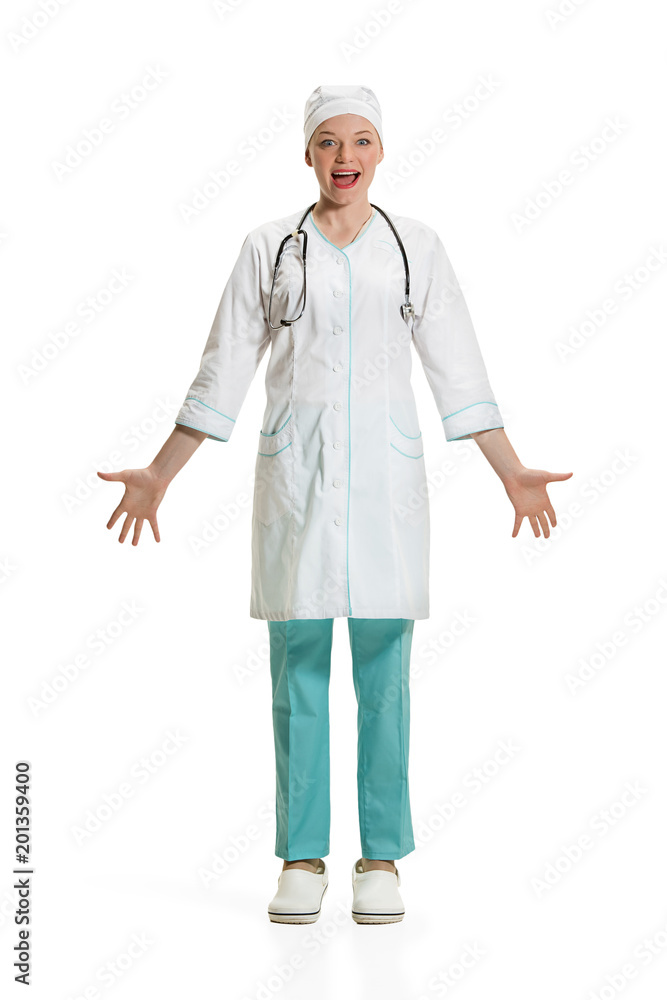 Beautiful young woman in white coat posing at studio. Full length studio shot isolated on white. Beautiful young woman in white coat posing at studio. Full length studio shot isolated on white.
