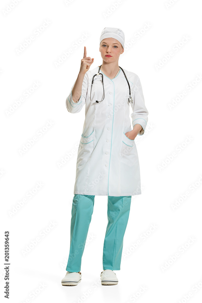 Beautiful young woman in white coat posing at studio. Full length studio shot isolated on white. Beautiful young woman in white coat posing at studio. Full length studio shot isolated on white.