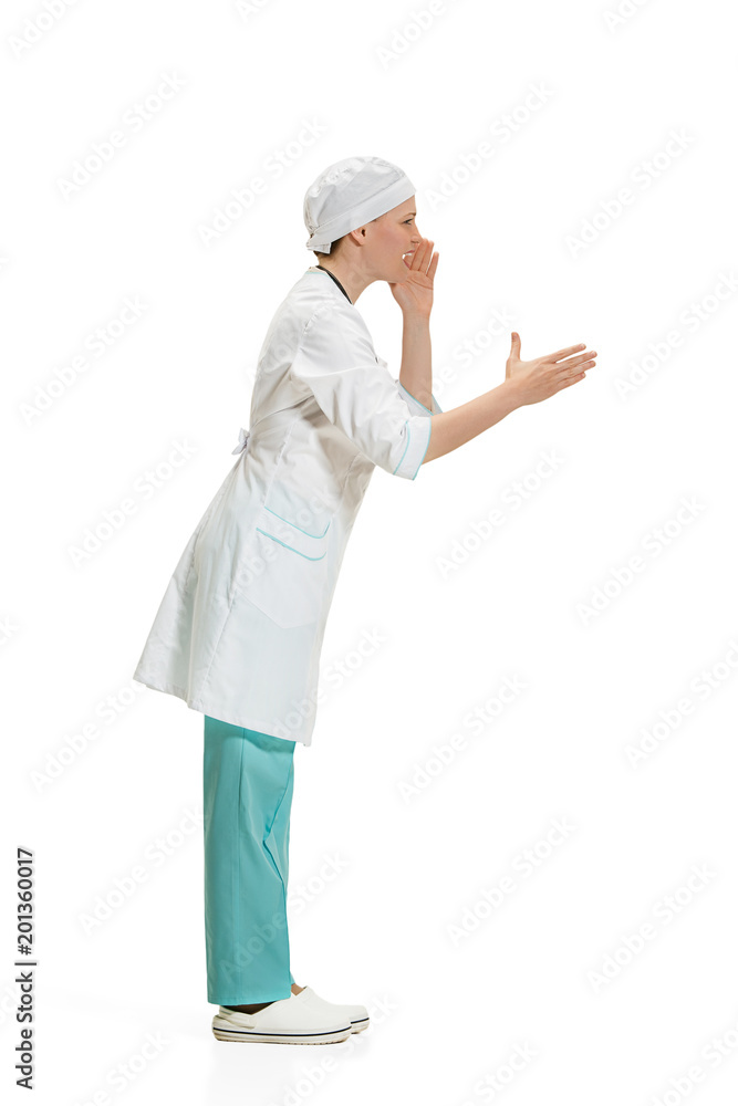 Beautiful young woman in white coat posing at studio. Full length studio shot isolated on white. Beautiful young woman in white coat posing at studio. Full length studio shot isolated on white.