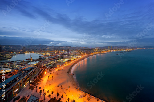 Aerial view of Barcelona Beach in summer night along seaside in Barcelona, Spain. Mediterranean Sea in Spain.