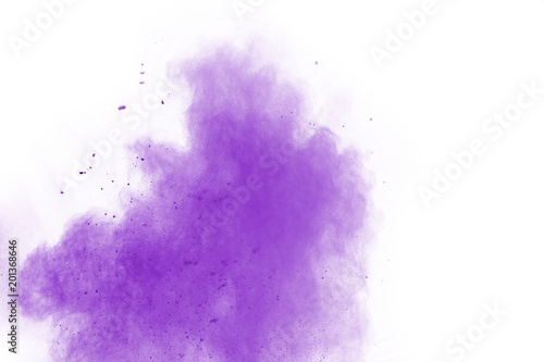 Powder explosion. Closeup of a purple dust particle explosion isolated on white. Abstract background.