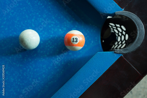 Sport billiard balls on blue billiard table