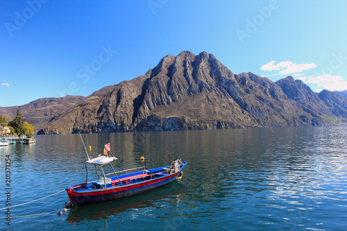 iseo lake - boat and mountain, view from port © ottoflick