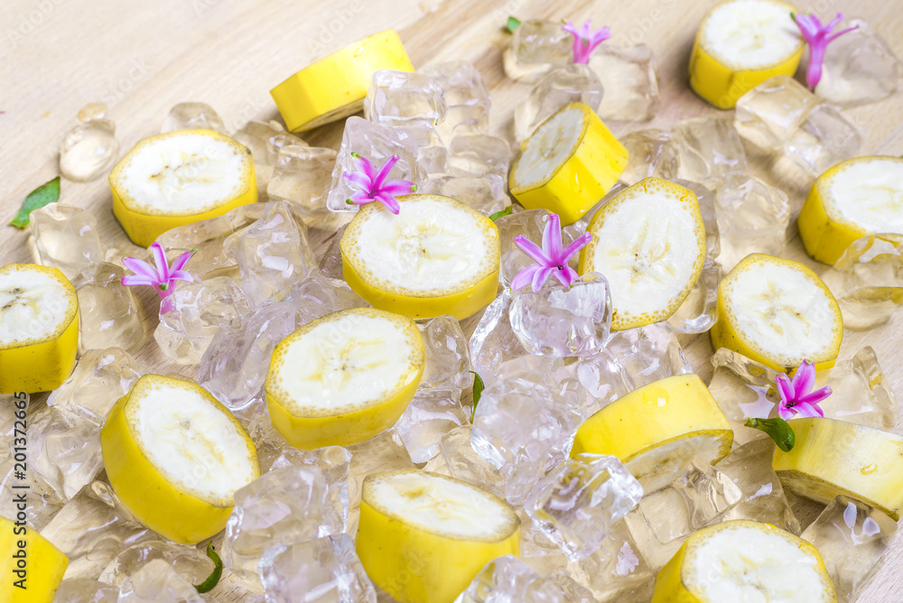 Pieces of ripe banana with peel on ice as a very icy refreshment Pieces of ripe banana with peel on ice as a very icy refreshment