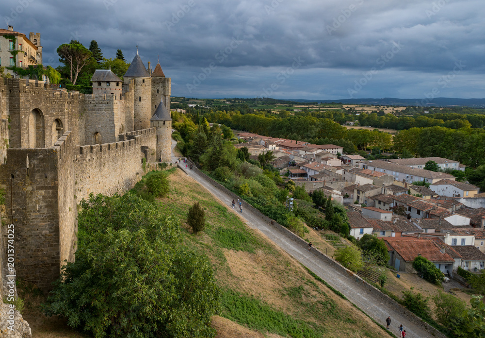 Carcassonne castle, surrounding town and countryside in the evening sunlight.
